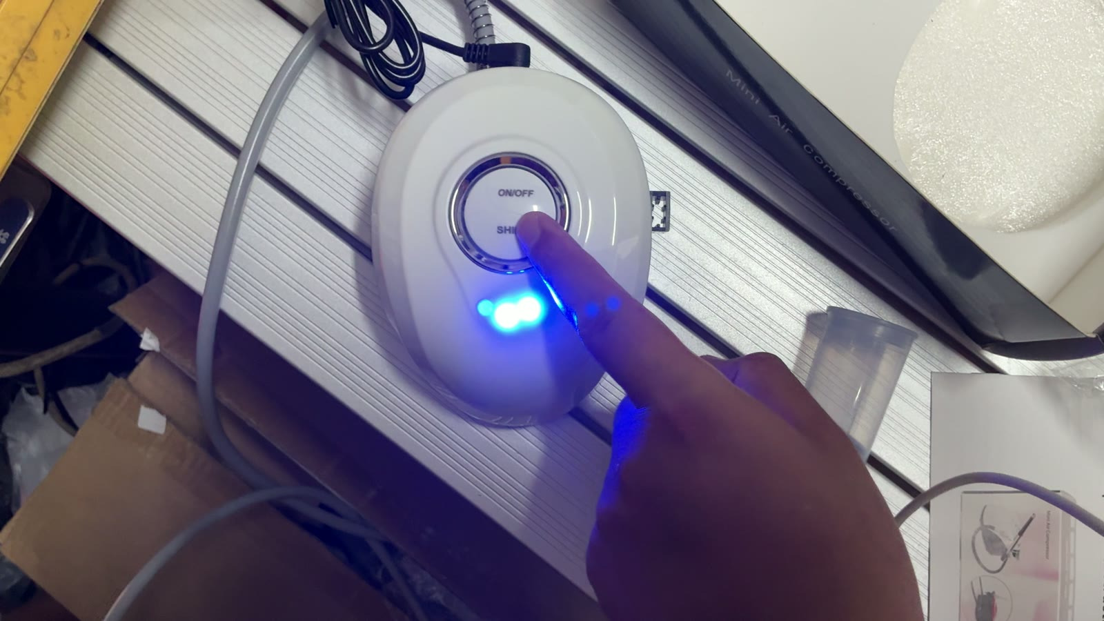 Airbrush compressor switched on during inspection in Yiwu