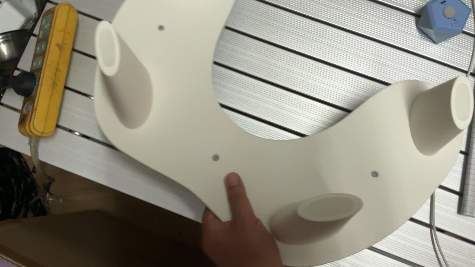 Nail hand rest held up for surface and finish inspection in Yiwu